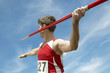 © moodboard - Male athlete about to throw javelin against the sky
