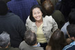 © moodboard - Portrait of happy Asian Chinese woman surrounded by people