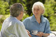 © MDBPIXS - Happy senior woman conversing with husband in backyard