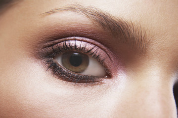 Wall Mural - Full frame image of woman's eye with pink eyeshadow