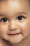 Fototapeta Koty - Closeup of cute baby boy looking up