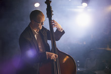 Man Playing The Double Bass On Stage