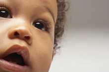 Closeup Of African American Curious Baby Boy Looking Away