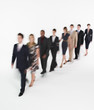 © moodboard - Full length of multiethnic businesspeople walking in blurred motion against white background