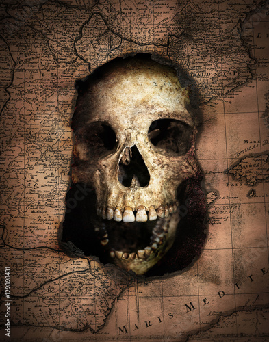 Pirate skull looking out of an old burnt map. Pirate and nautical theme grung...