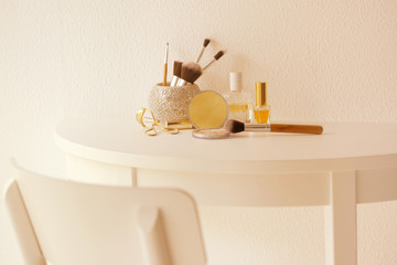 Wall Mural - Set of cosmetics on white table against light textured background