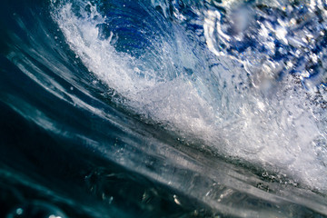 Wall Mural - inside blue ocean wave. sea water in barrel shape wave closing