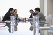 © MDBPIXS - Four Indian business people discussing at conference table