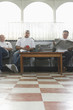 © MDBPIXS - Three barbers waiting for customers in barbershop