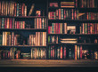 blurred Image Many old books on bookshelf in library
