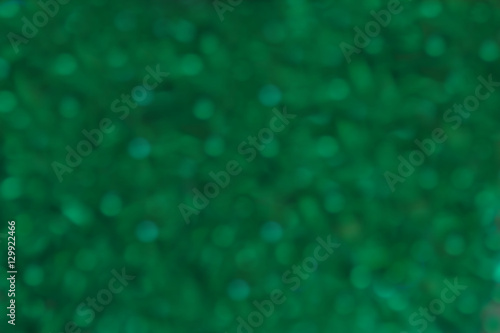 blurred green spotted background
