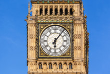 Close Up Of Big Ben's Clock Face With A Clear Blue Sky Behind