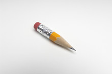 Closeup Of Small Sharpened Pencil Isolated Over White Background