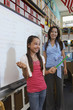 © MDBPIXS - Teacher looking at girl giving presentation in classroom