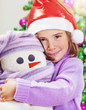 © Anna Om - Cute girl with snowman toy