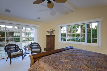 Wall Mural - Cropped bed with two armchairs by window in elegant bedroom