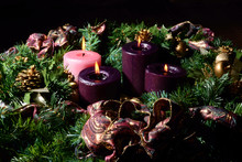 Traditional Advent Wreath On Rustic Table With Candles Glowing Warm