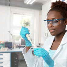Female African-american Scientist Or Graduate Student Working