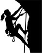 Female climber silhouette in ropes an a rock