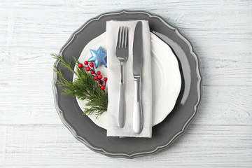 Wall Mural - Empty plate, fork  and knife on wooden background