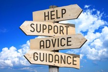 Wooden Signpost With Four Arrows - Help, Support, Advice, Guidance - Great For Topics Like Frequently Asked Questions, Customer Support Etc.