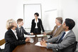 © MDBPIXS - Multiethnic businesspeople at meeting in conference room