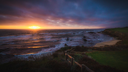 Wall Mural - Dramatic sunset at Half Moon Bay beach