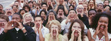 Panoramic shot of crowd shouting with hands on face
