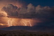 © robertharding - Electrical storm with forked lightning over the Grapevine mountains of the Amargosa Range, Mesquite Flats Sand dunes in the valley, Stovepipe Wells, Death Valley National Park, California