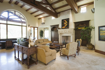 View of spacious living room with beamed ceiling at home