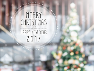 Wall Mural - Christmas and Happy new year 2017 on blurred bokeh christmas tree background