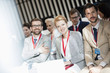 © MDBPIXS - Portrait of happy business people sitting in seminar hall