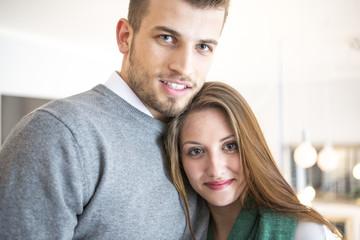 Portrait of confident young couple at cafe