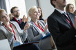 © MDBPIXS - Happy business people applauding during seminar