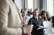 © MDBPIXS - Businessman looking at public speaker during seminar