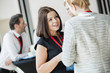 © MDBPIXS - Businesswomen talking during coffee break at convention center
