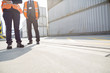 © MDBPIXS - Low section of workers standing in shipping yard