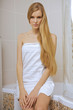 © MDBPIXS - Young woman wearing a towel in bathroom