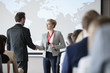 © MDBPIXS - Business people shaking hands during seminar