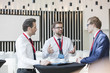 © MDBPIXS - Businessman discussing with colleagues during coffee break in convention center
