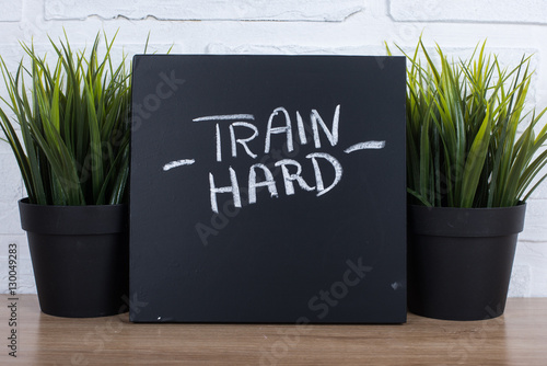 Tela Sports motivational text. Train hard.