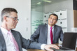 © MDBPIXS - Mature businessmen discussing in office