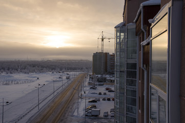 Road in the winter street. Evening, sunset