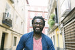 © santypan - Young african man in the street.