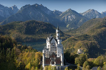 Romantic Neuschwanstein Castle And German Alps In Autumn, Southern Part Of Romantic Road, Bavaria, Germany