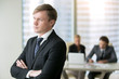 © fizkes - Portrait of a young serious businessman thinking