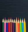 Color pencils on black wood background