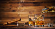 © Jag_cz - Glasses of whiskey with ice cubes served on wood