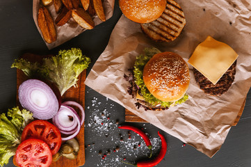 Wall Mural - Delicious fresh homemade burger on a wooden table