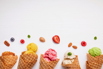 Fototapete - Colorful ice cream with cones and various fruits raspberry ,blue